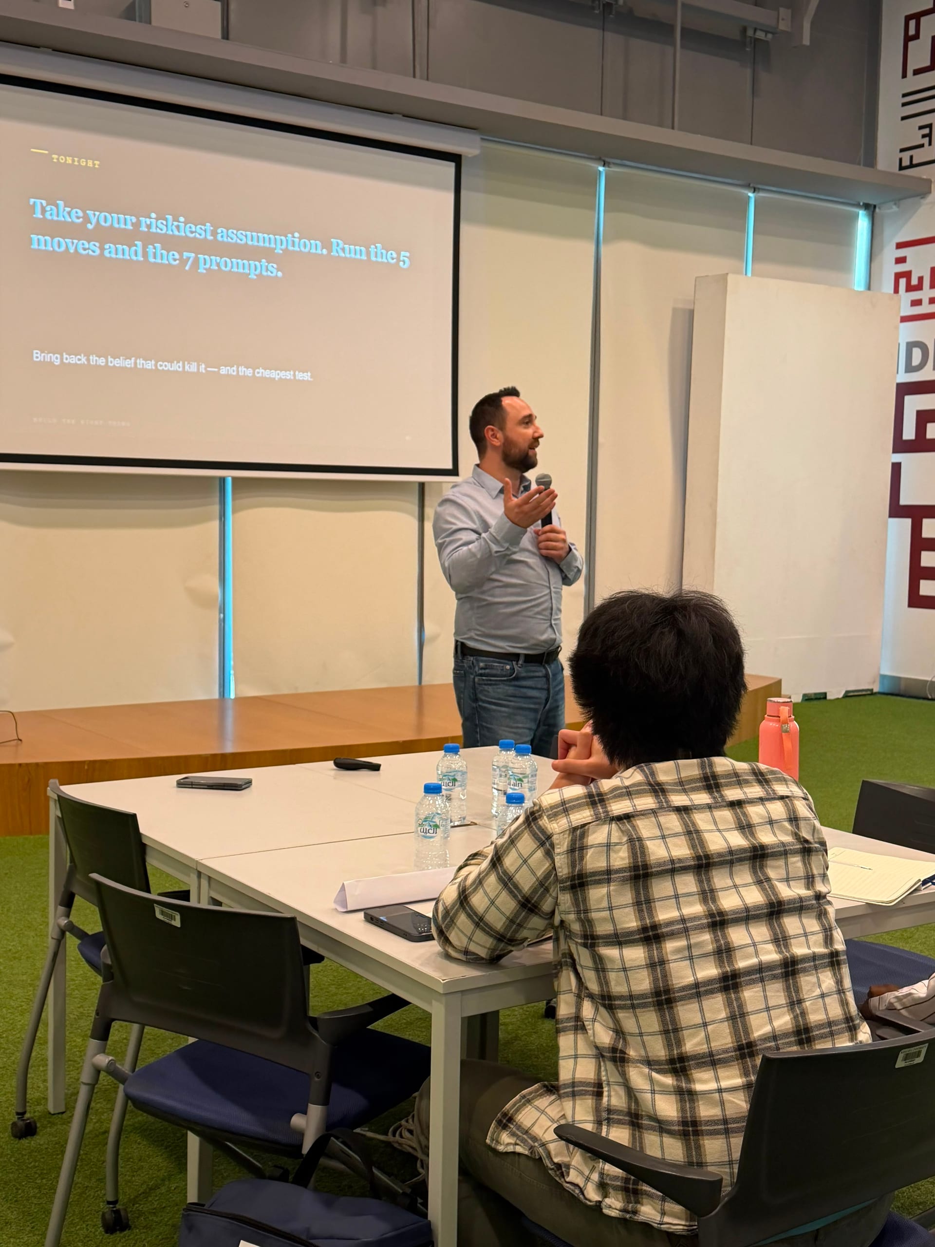 Kamil Dzikowski speaking at a startup workshop at Khalifa University, Abu Dhabi